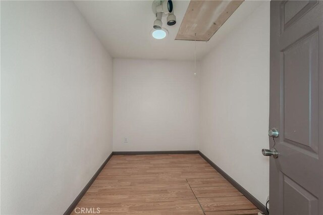 unfurnished room with light wood-type flooring