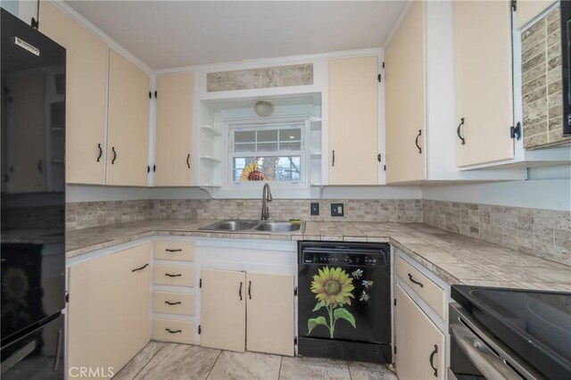 kitchen with backsplash, tile countertops, sink, and black appliances