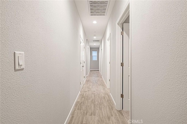 hall featuring light hardwood / wood-style flooring