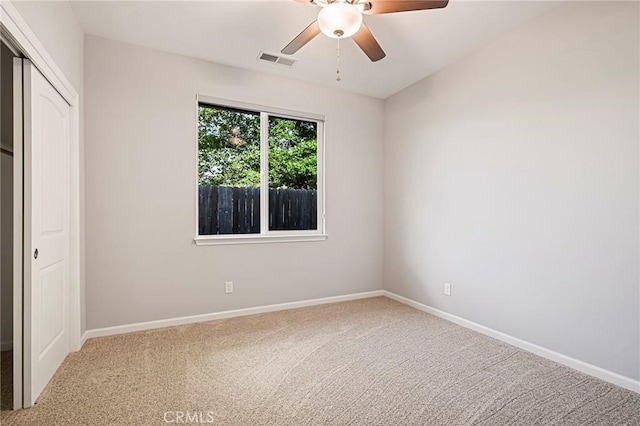 unfurnished bedroom with carpet floors, a closet, and ceiling fan