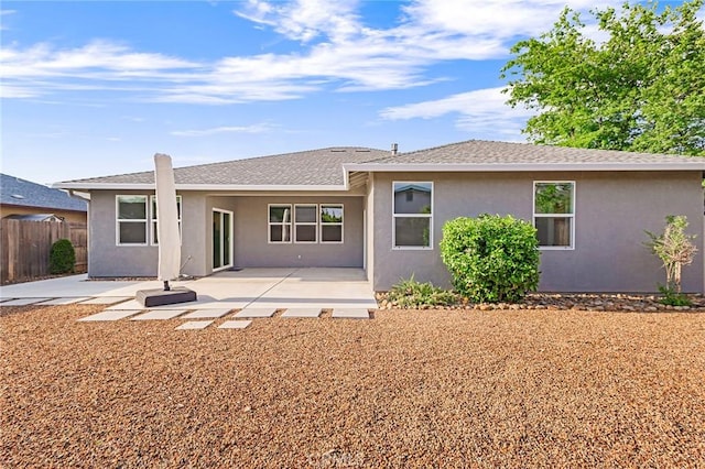 back of property featuring a patio