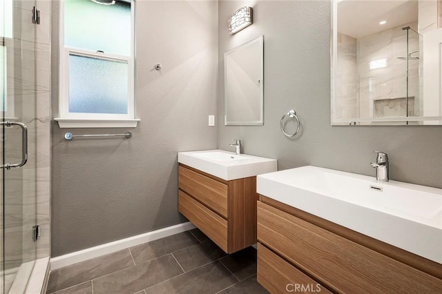 bathroom with vanity, tile patterned floors, and a shower with door