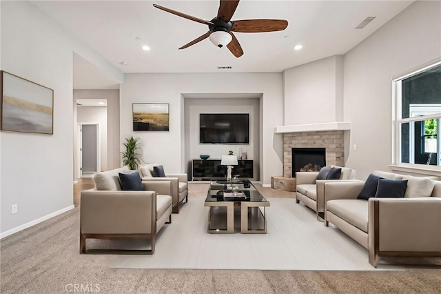 living room featuring ceiling fan and light carpet