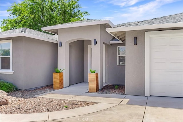 property entrance with a garage