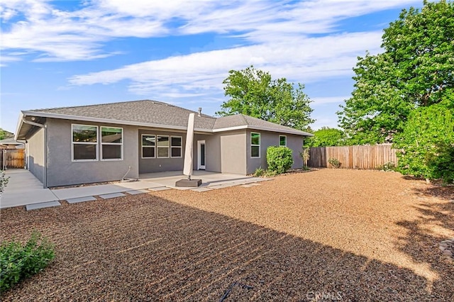 rear view of property with a patio area