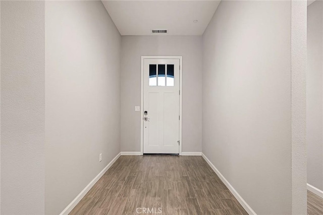 doorway to outside featuring wood-type flooring