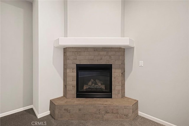 interior details with a fireplace and carpet floors