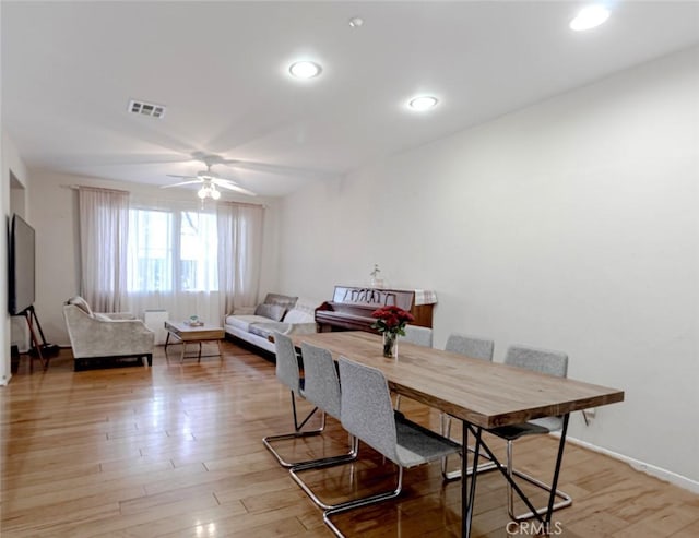 dining room featuring ceiling fan and light hardwood / wood-style flooring