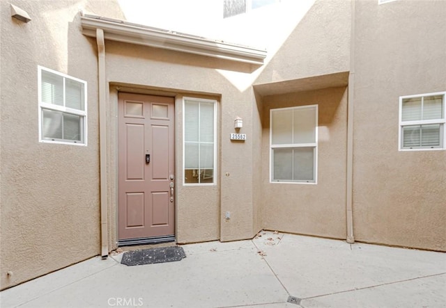 property entrance with a patio area