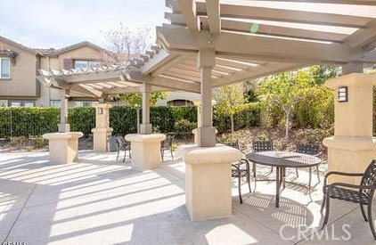 view of patio featuring a pergola