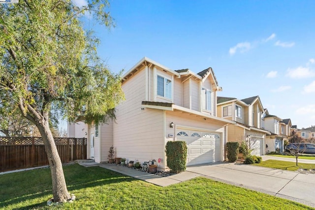 view of front of property with a garage and a front lawn