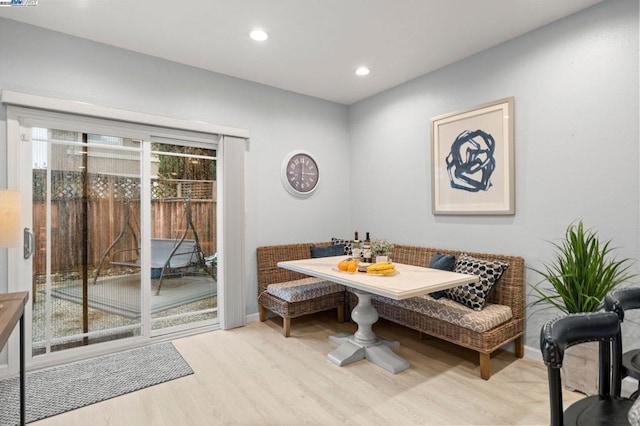 dining space with breakfast area and light hardwood / wood-style flooring