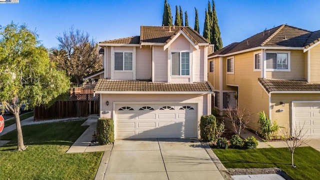 front of property with a garage and a front yard