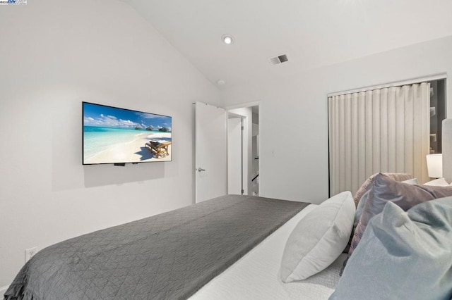 bedroom with lofted ceiling