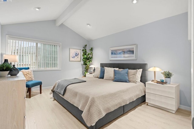 bedroom featuring lofted ceiling with beams and light hardwood / wood-style floors