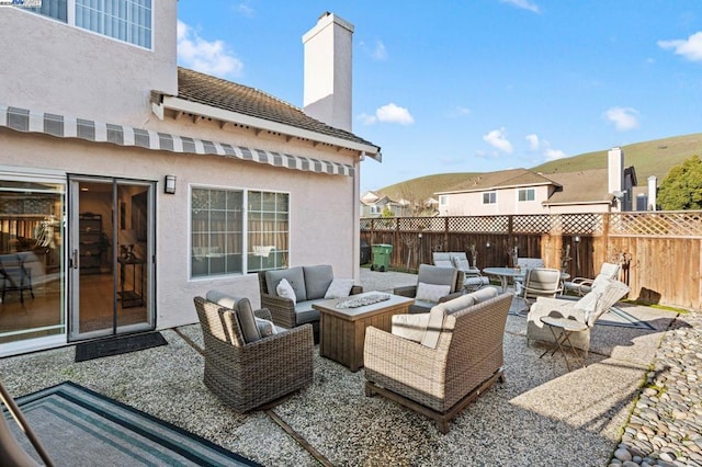 view of patio / terrace featuring an outdoor living space with a fire pit