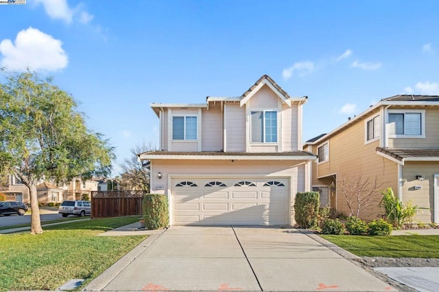 view of front of property featuring a garage and a front yard