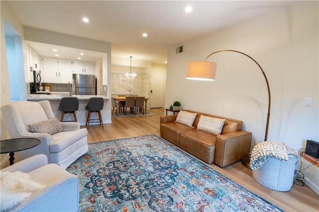 living room with light hardwood / wood-style floors