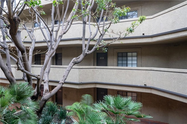 view of home's exterior with a balcony