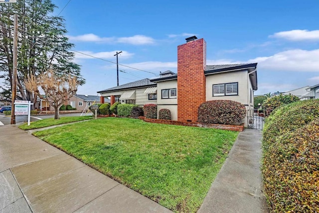 view of home's exterior featuring a yard