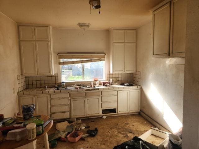 kitchen with tile counters and backsplash