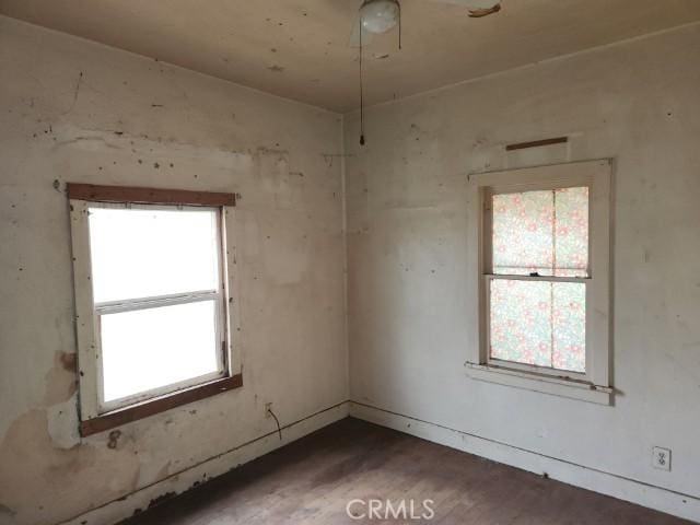 unfurnished room with hardwood / wood-style floors