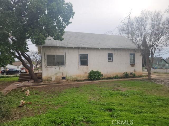 view of property exterior featuring a lawn