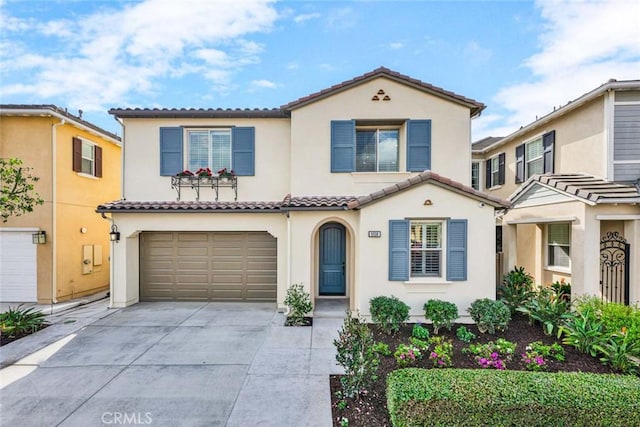 mediterranean / spanish-style house featuring a garage