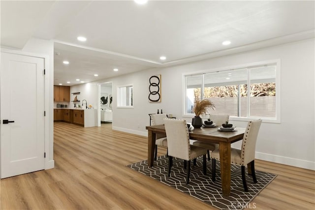 dining room featuring light hardwood / wood-style floors