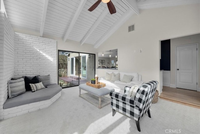 living room featuring ceiling fan, beam ceiling, high vaulted ceiling, and hardwood / wood-style floors