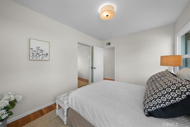 bedroom with wood-type flooring