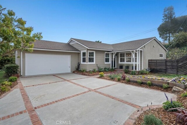 ranch-style house featuring a garage