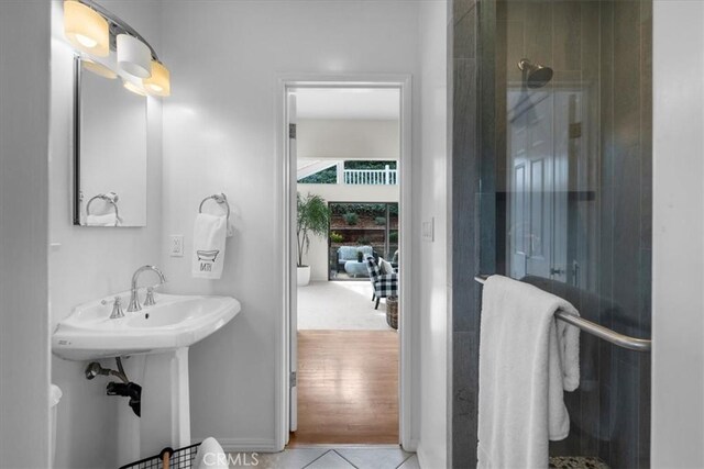 bathroom with tile patterned floors and walk in shower