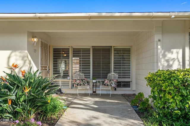 property entrance featuring a patio area