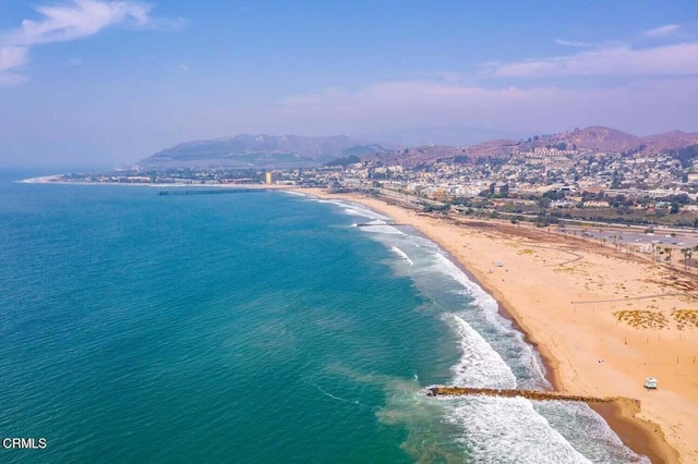 view of water feature featuring a mountain view and a view of the beach