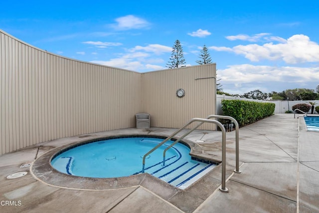 view of swimming pool featuring a patio area