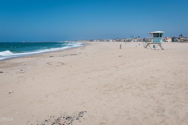 property view of water featuring a beach view