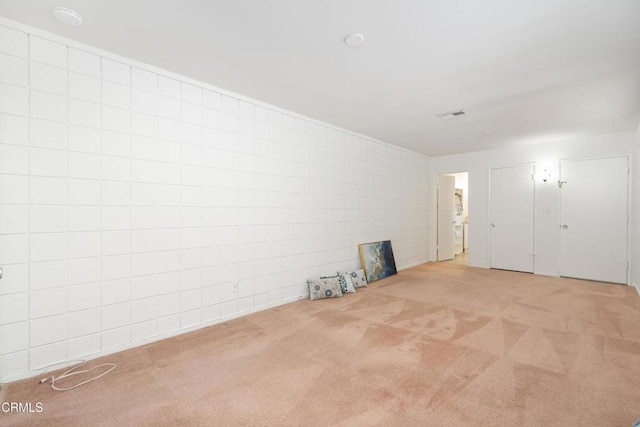 unfurnished room featuring carpet flooring