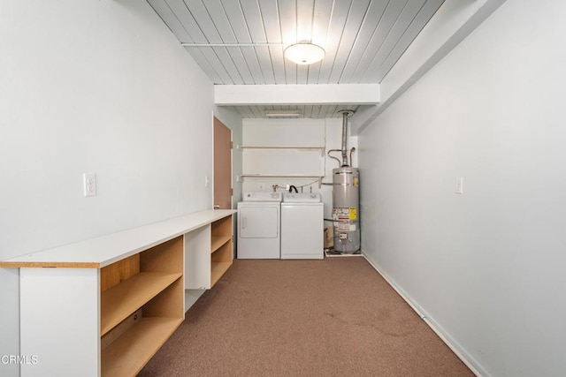 laundry area with gas water heater, washing machine and dryer, and carpet flooring