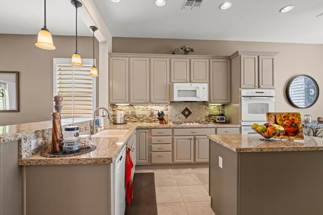 kitchen with pendant lighting, sink, decorative backsplash, light tile patterned floors, and white appliances