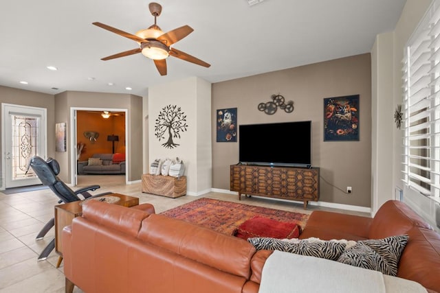 tiled living room with ceiling fan