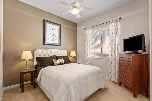 bedroom featuring ceiling fan and light carpet