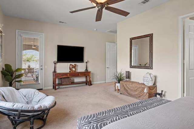 living room with ceiling fan and carpet flooring