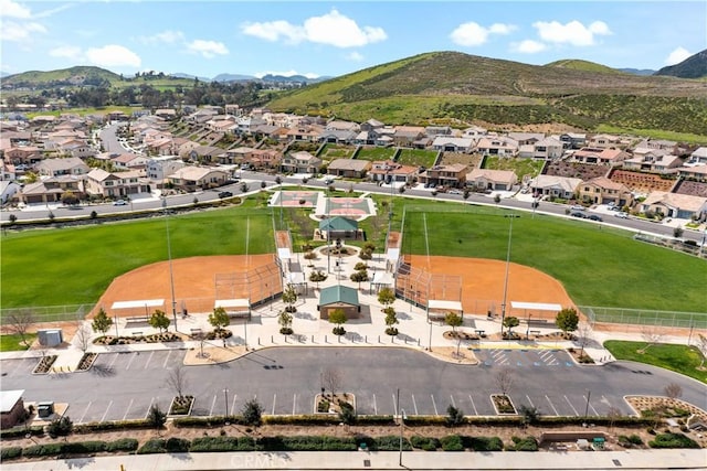 birds eye view of property with a mountain view