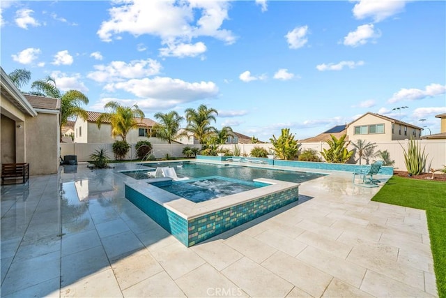 view of swimming pool with an in ground hot tub and a patio