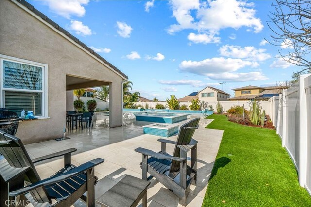 view of patio with a swimming pool with hot tub