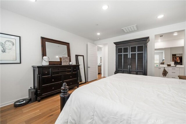 bedroom featuring light wood-type flooring