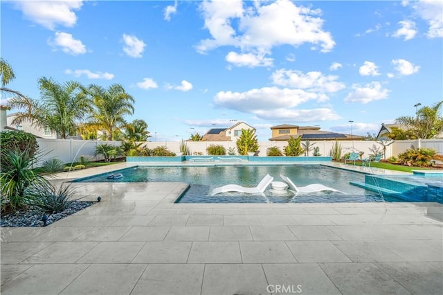 view of pool featuring pool water feature and a patio