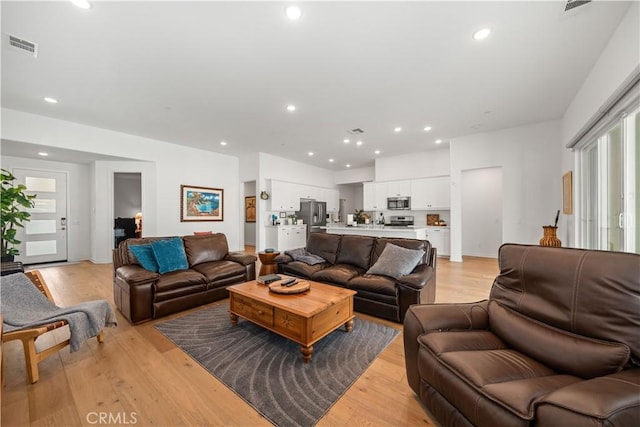 living room with light hardwood / wood-style floors