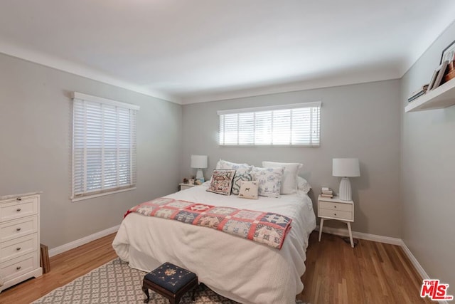 bedroom with light wood-type flooring